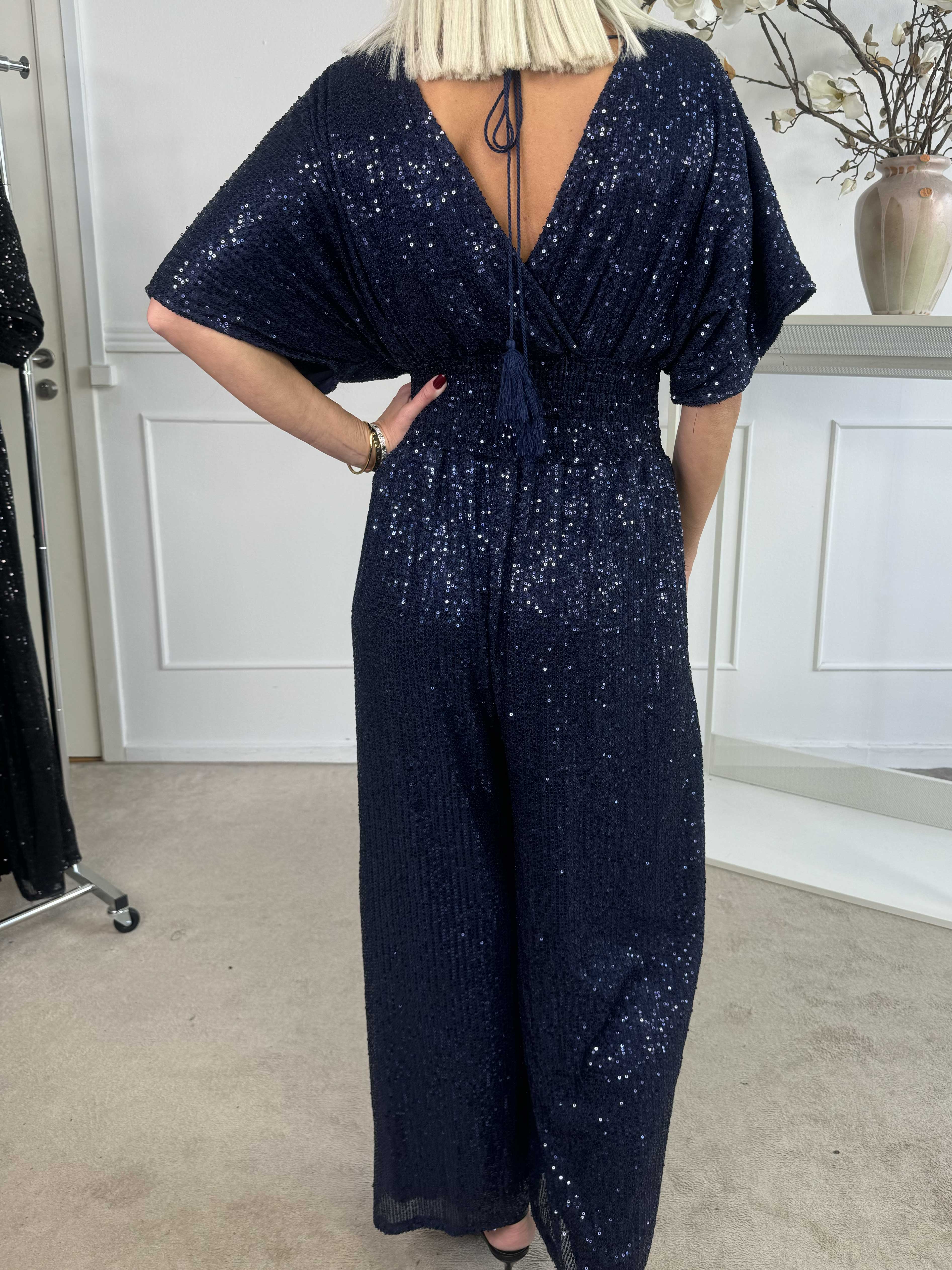 Pams Glitter Jumpsuit - Elastisk jumpsuit med smock och paljetter